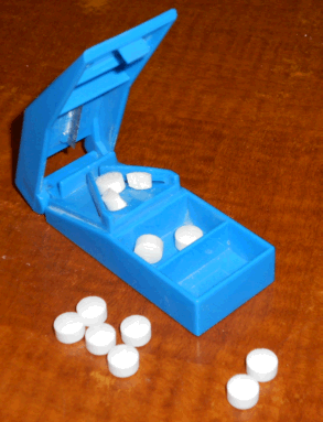 Image of pain medication in pill cutter
